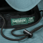 The Legacy Tag on the Ocean City New Jersey 1897 Bucket Hat | Blue Steel Bucket Hat