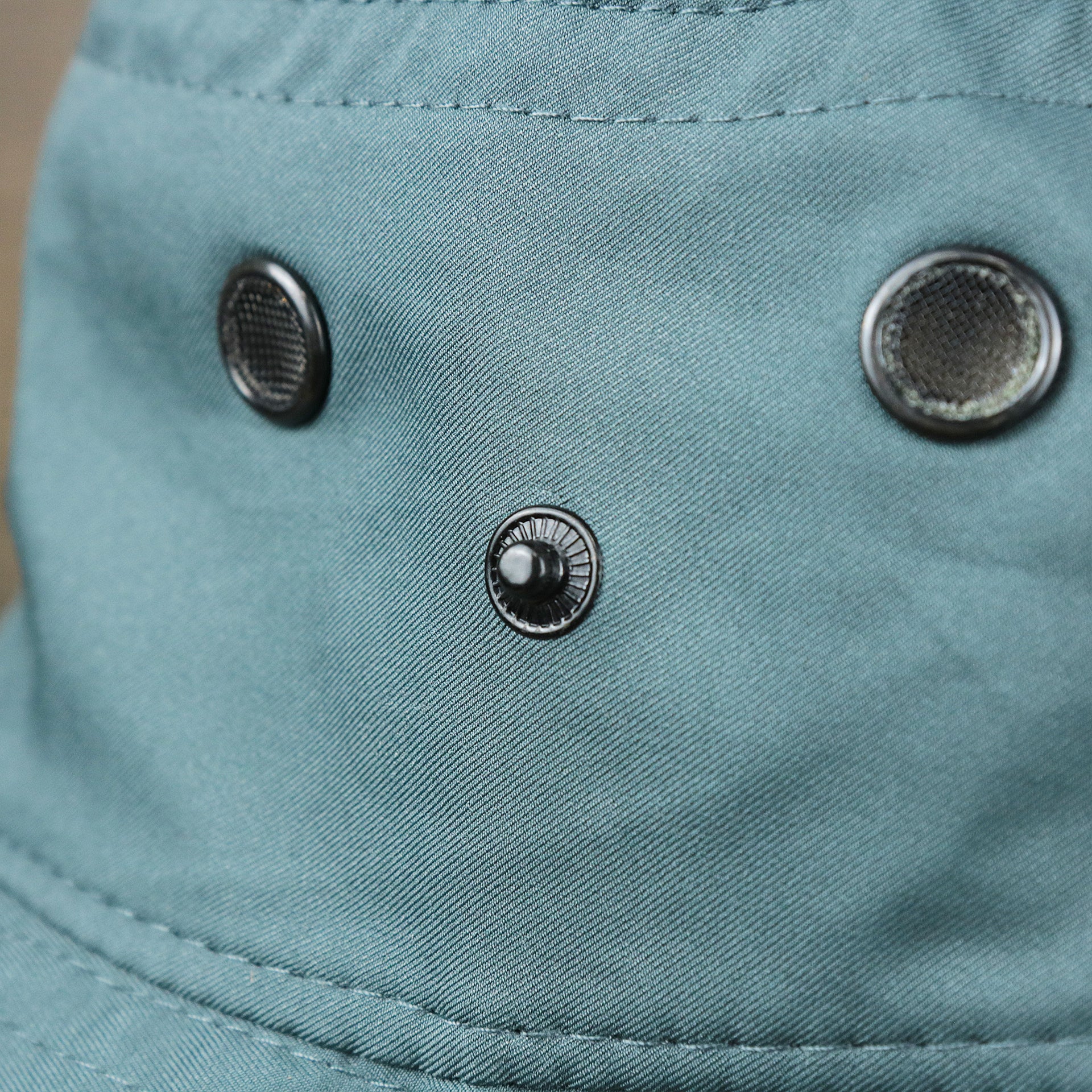 The button on the Ocean City New Jersey 1897 Bucket Hat | Blue Steel Bucket Hat