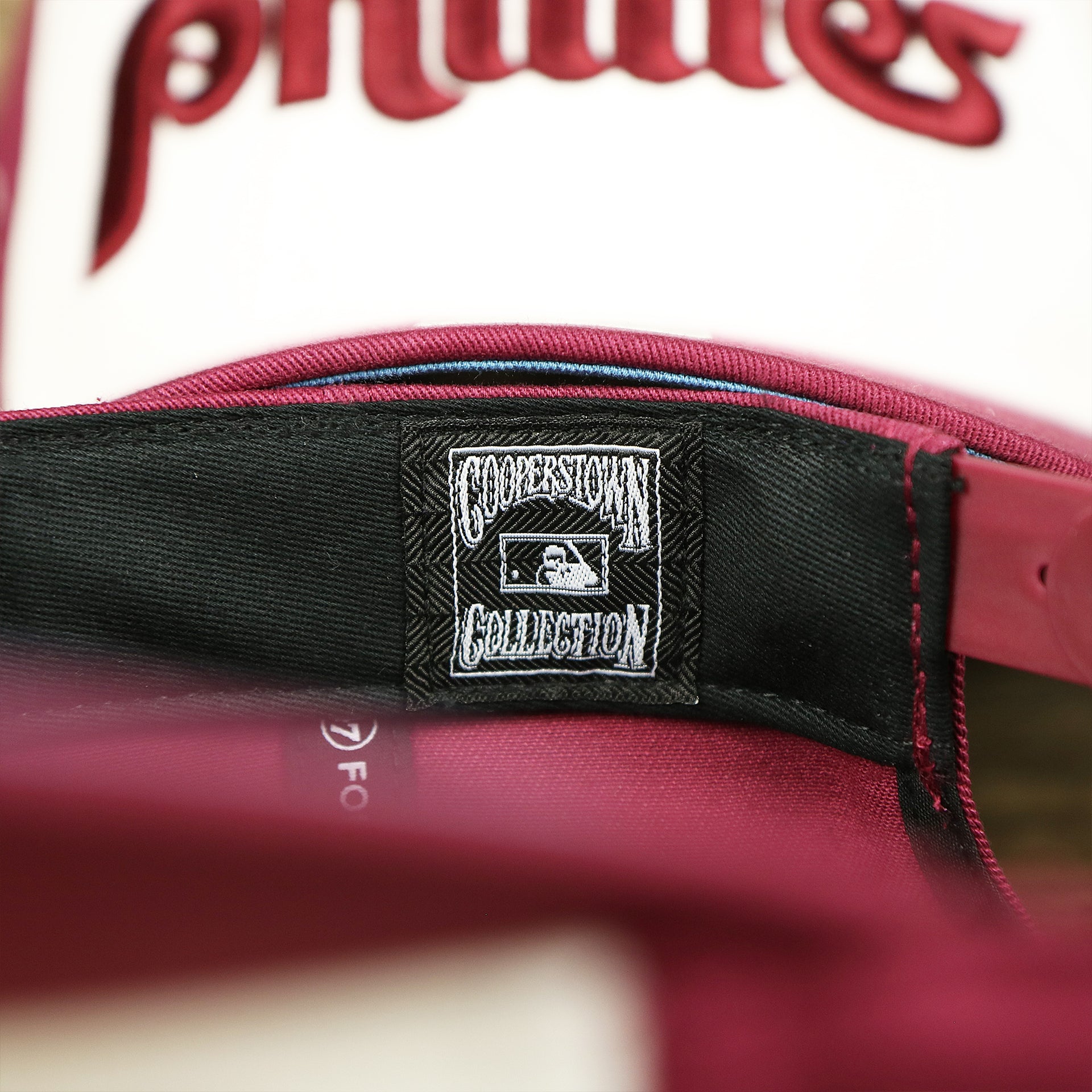 The Cooperstown Collection Tag on the Cooperstown Philadelphia Phillies Wordmark Retro Phillies Logo Patch Dad Hat | Cardinal Dad Hat