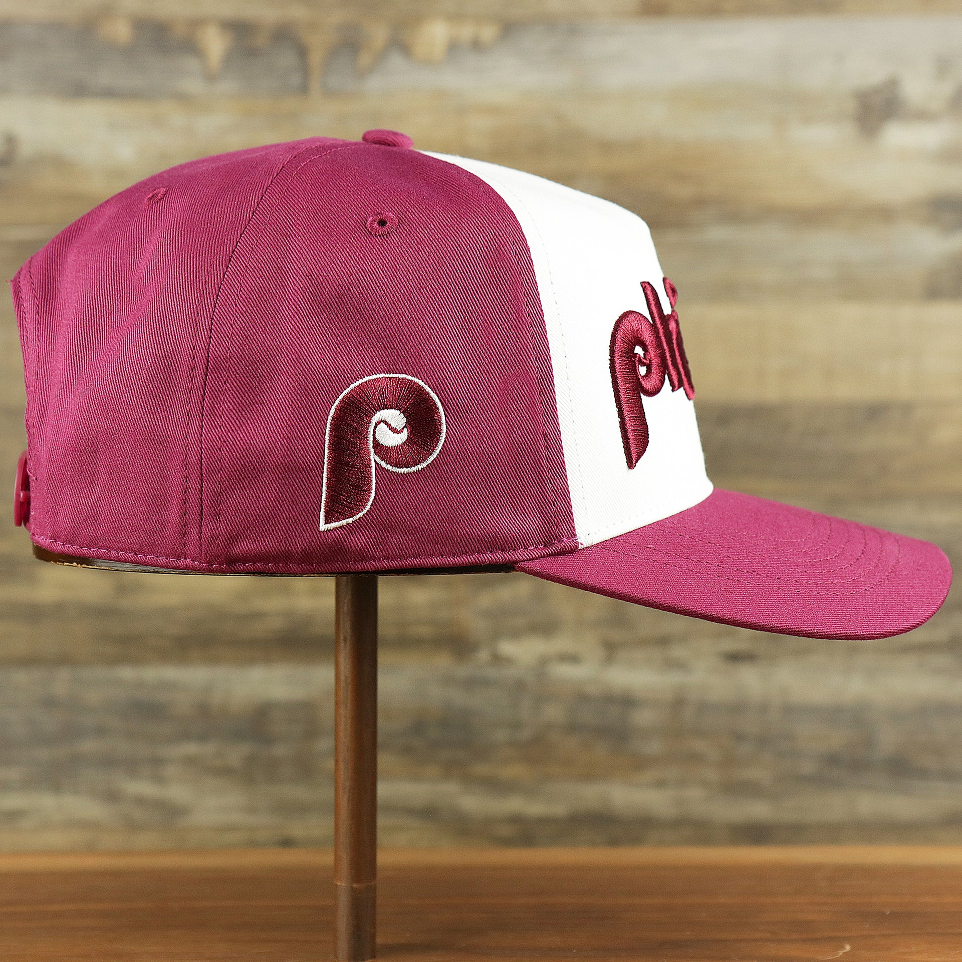 The wearer's right on the Cooperstown Philadelphia Phillies Wordmark Retro Phillies Logo Patch Dad Hat | Cardinal Dad Hat