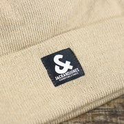 A close up of the logo on the Jack And Jones Crockery High Cuff Knit Beanie | Tan Knit Beanie