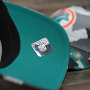 The undervisor on the Throwback Miami Dolphins OnField NFL Summer Training 2022 39Thirty Camo FlexFit Cap | New Era Turquoise