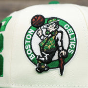 The Logo on the Boston Celtics NBA 2022 Draft Gray Bottom 9Fifty Snapback | New Era Cream/Kelly Green