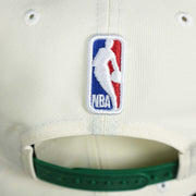 The NBA Jerry West Logo on the back of the Boston Celtics NBA 2022 Draft Gray Bottom 9Fifty Snapback | New Era Cream/Kelly Green