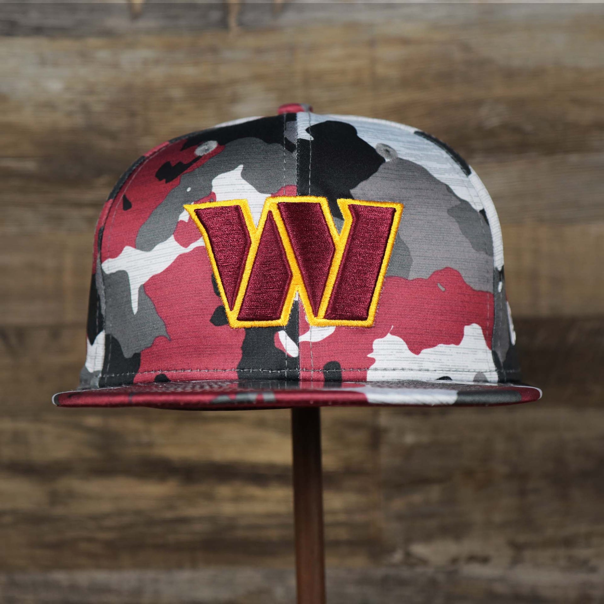 The front of the Washington Commanders NFL OnField Summer Training 2022 Camo 9Fifty Snapback | Burgundy Camo 9Fifty