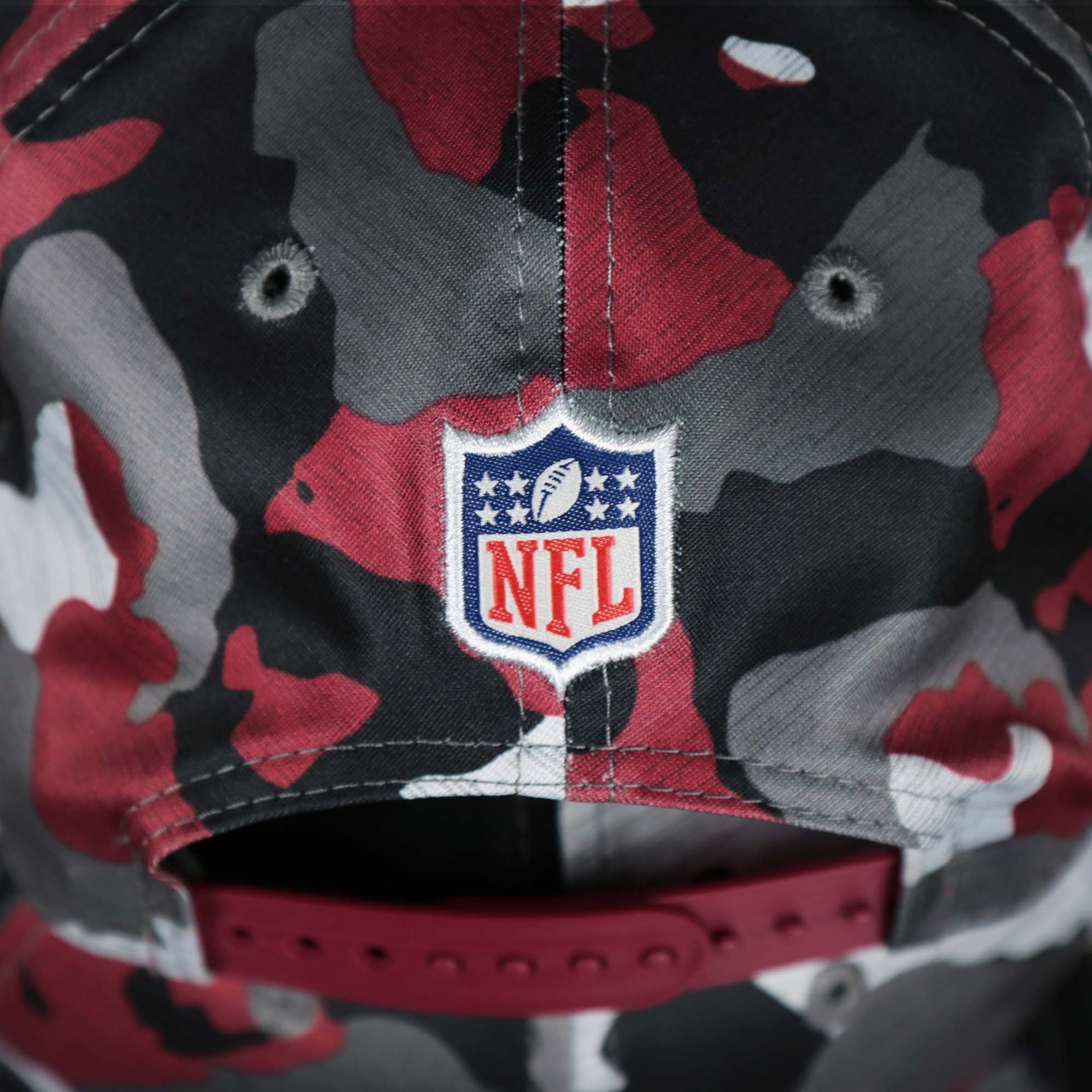 The NFL Logo Patch on the back of the Washington Commanders NFL OnField Summer Training 2022 Camo 9Fifty Snapback | Burgundy Camo 9Fifty