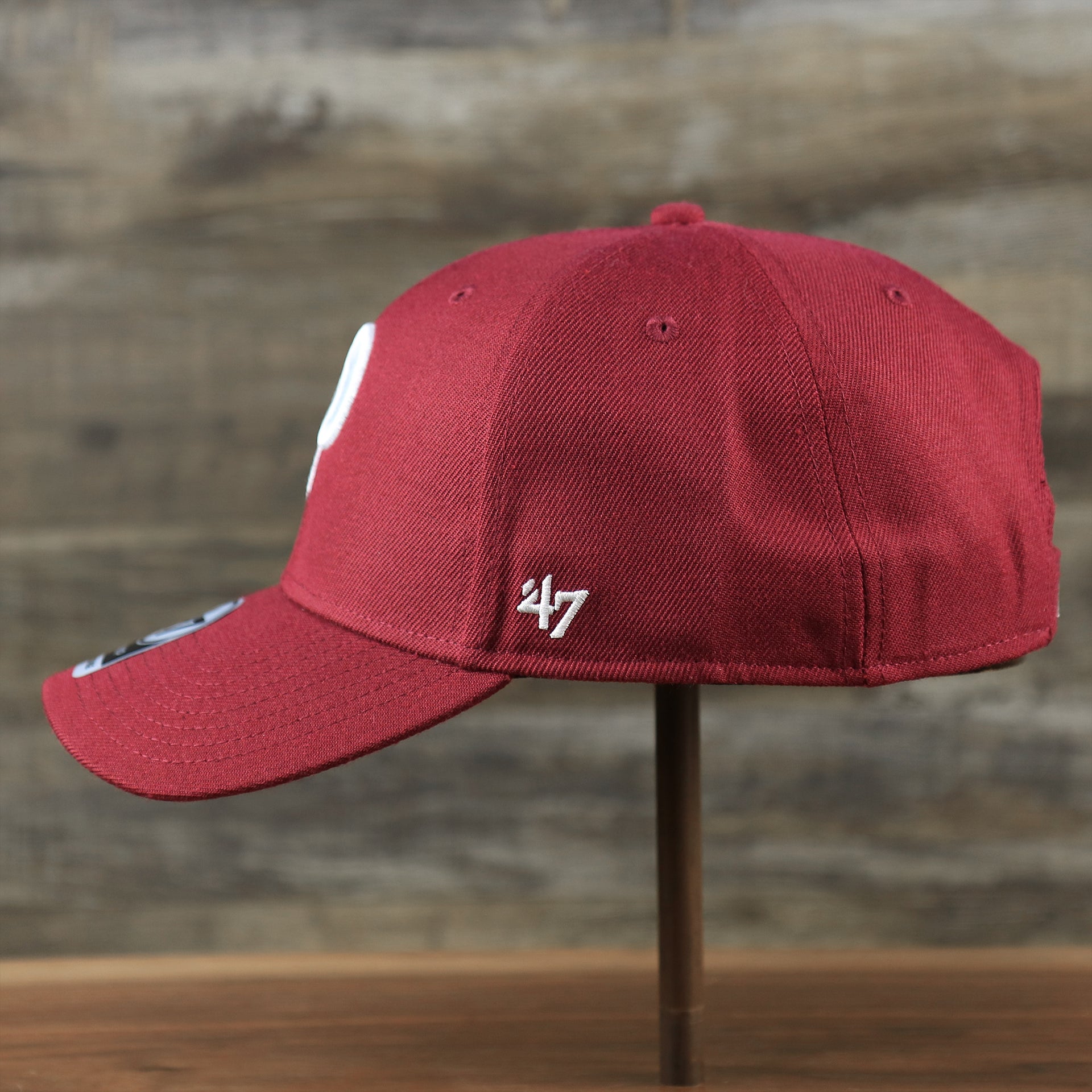 The wearer's left on the Cooperstown Philadelphia Phillies Retro Phillies Logo Gray Bottom Dad Hat | Maroon Dad Hat