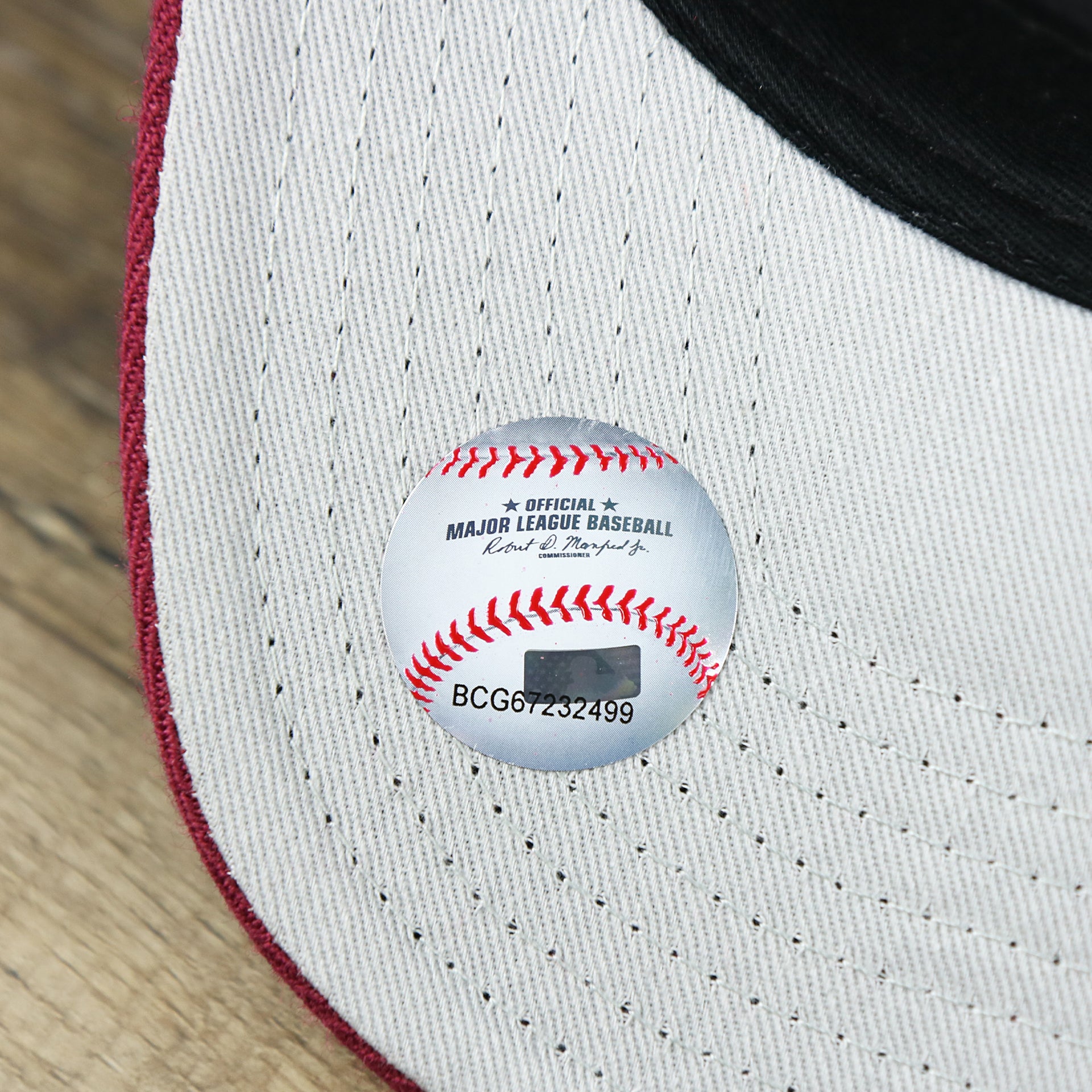 The MLB Sticker on the Cooperstown Philadelphia Phillies Retro Phillies Logo Gray Bottom Dad Hat | Maroon Dad Hat