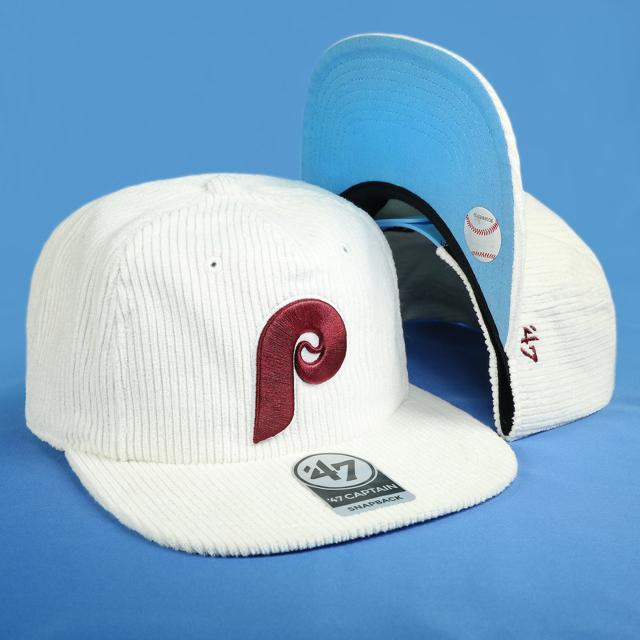 The Cooperstown Philadelphia Phillies Corduroy Snapback Hat | White Corduroy Snap Cap on a blue background