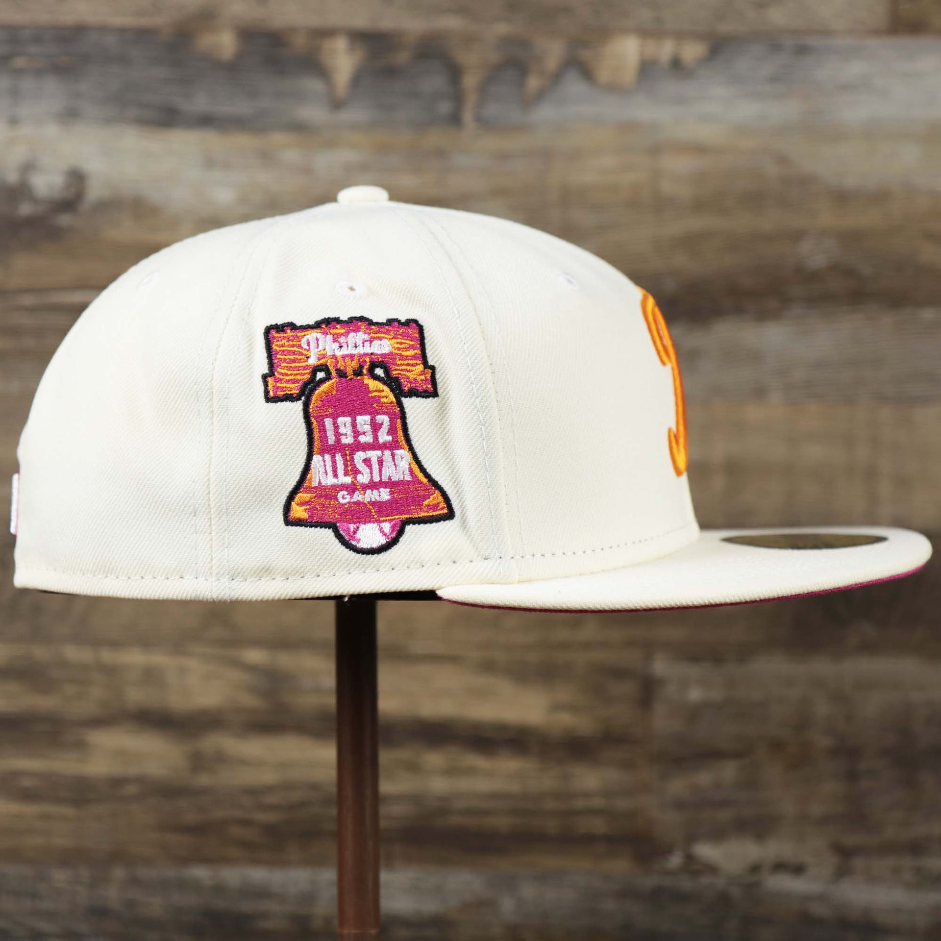 The wearer's right on the Cooperstown Philadelphia Phillies Coffee Shop 1952 All Star Game Liberty Bell Side Patch 59Fifty Fitted Cap | New Era Off White 59Fifty