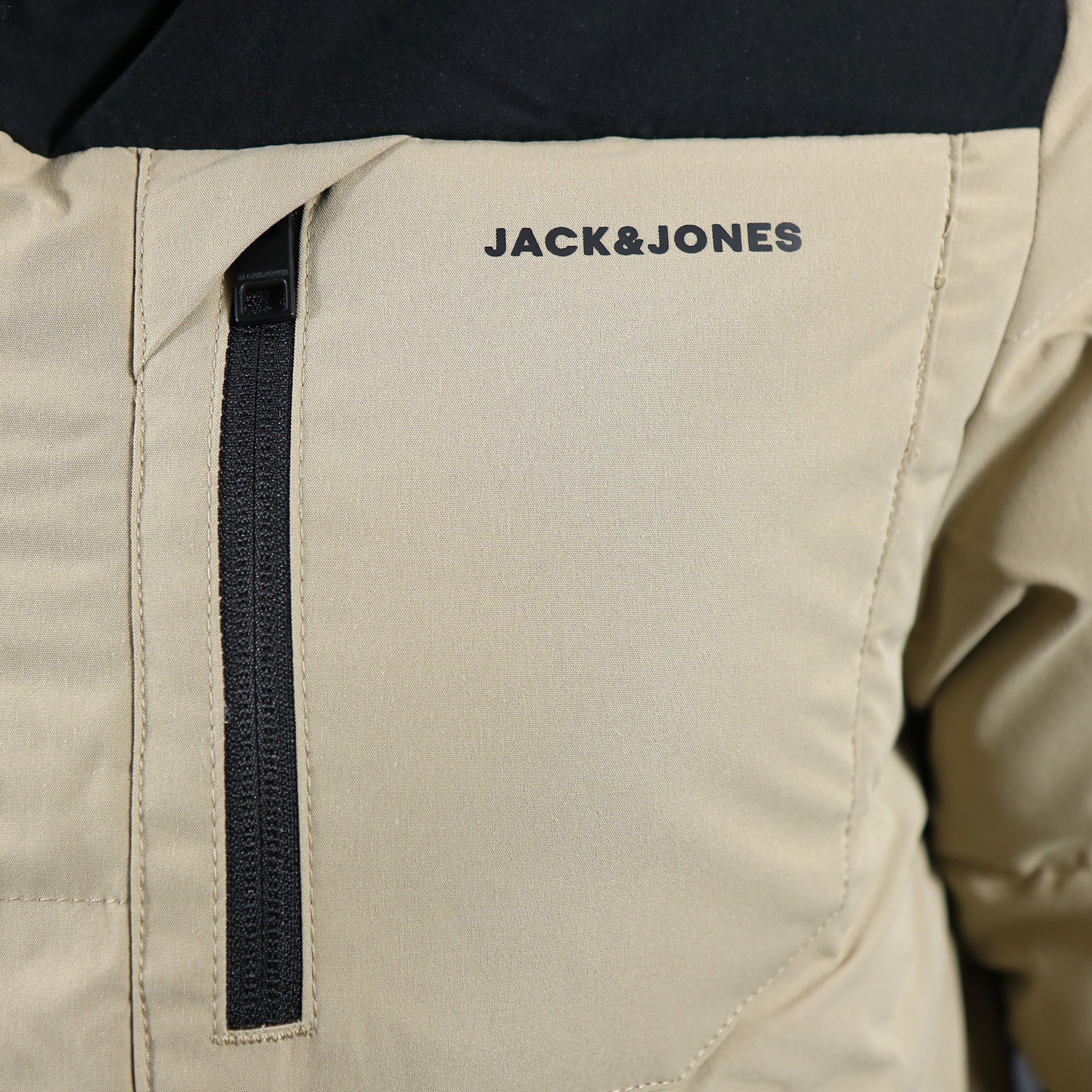 The Jack and jones chest pocket on the Jack And Jones Dune Puffer Jacket With Hidden Pocket | Black and Tan Puffer Jacket