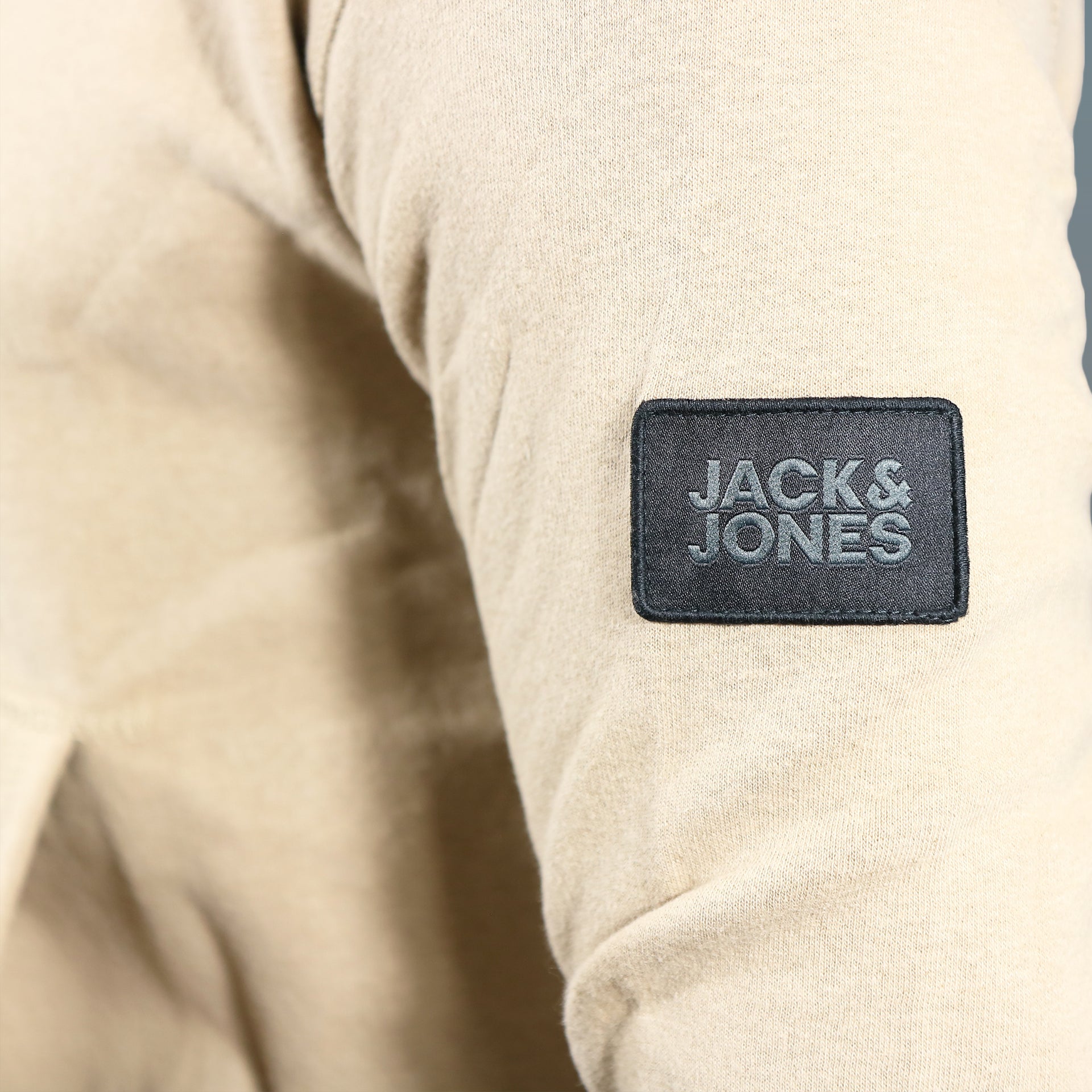 The Jack and Jones Patch on the Jack And Jones Dune Pullover Hoodie | Tan Hoodie