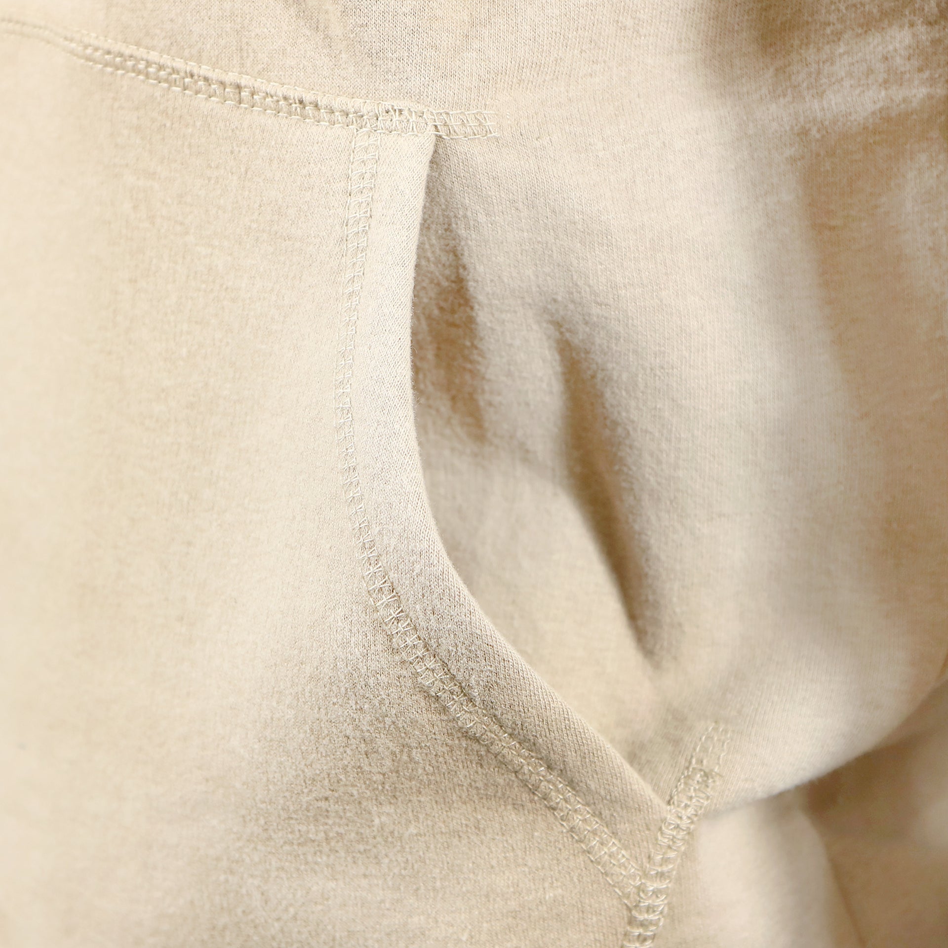 The front pocket on the Jack And Jones Dune Pullover Hoodie | Tan Hoodie