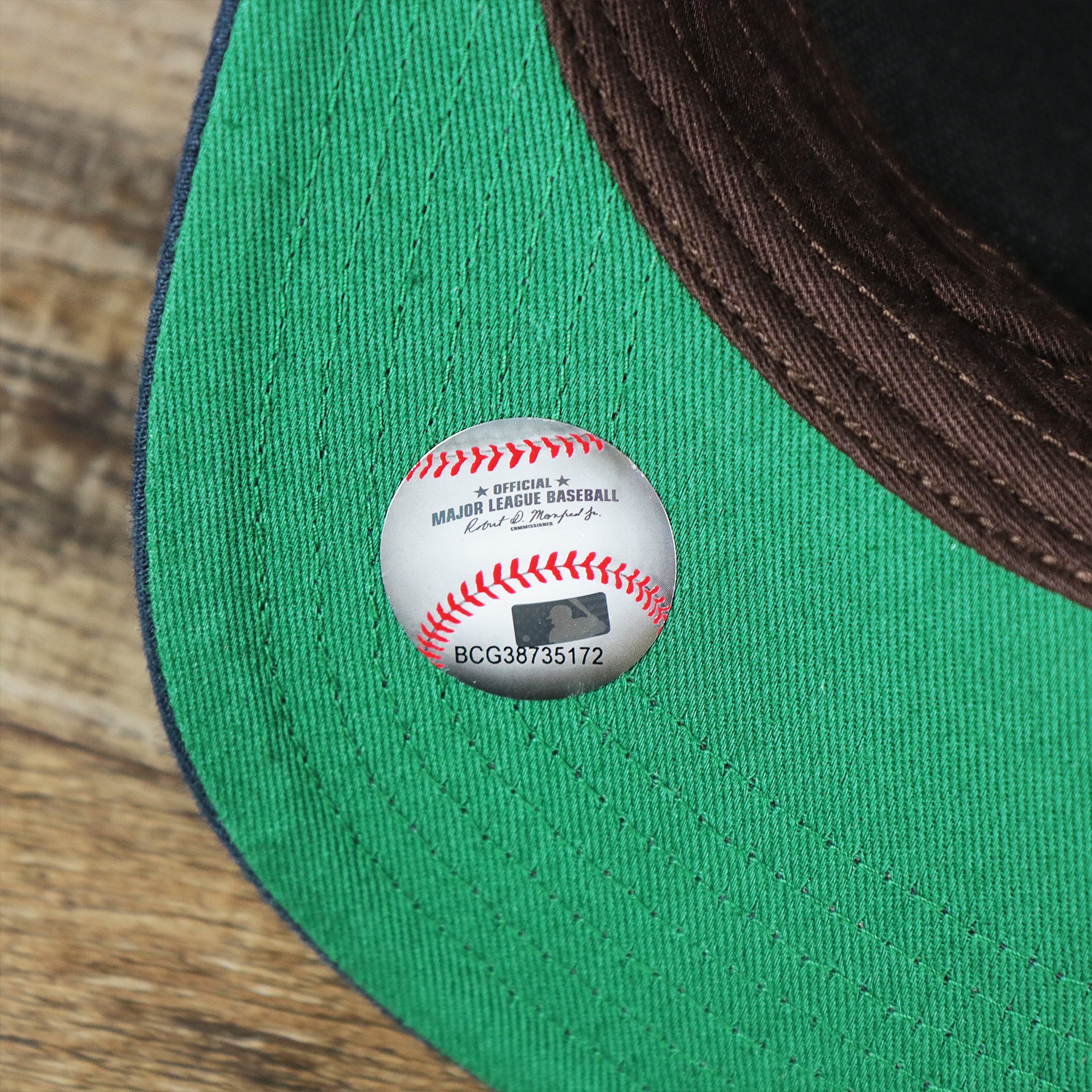 The MLB Baseball Sticker on the Cooperstown Detroit Tigers Felt Tigers Logo Snapback Hat | Navy Blue Snapback Cap