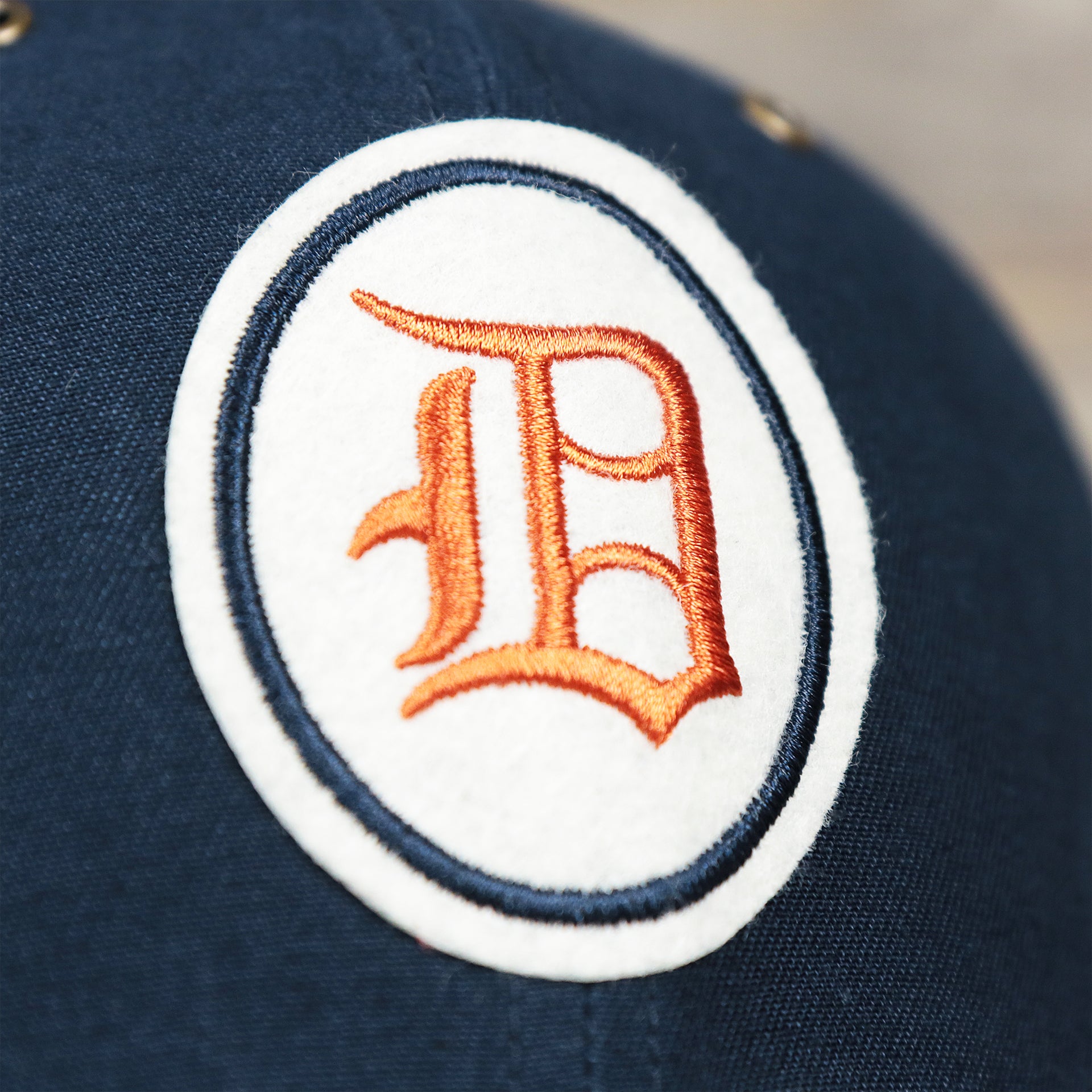 The Felt Detroit Tigers Logo on the Cooperstown Detroit Tigers Felt Tigers Logo Snapback Hat | Navy Blue Snapback Cap