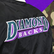 A close up of the Diamondbacks Wordmark Retro Logo on the Cooperstown Arizona Diamondbacks MLB Patch Alpha Industries Reversible Bomber Jacket With Camo Liner | Black Bomber Jacket