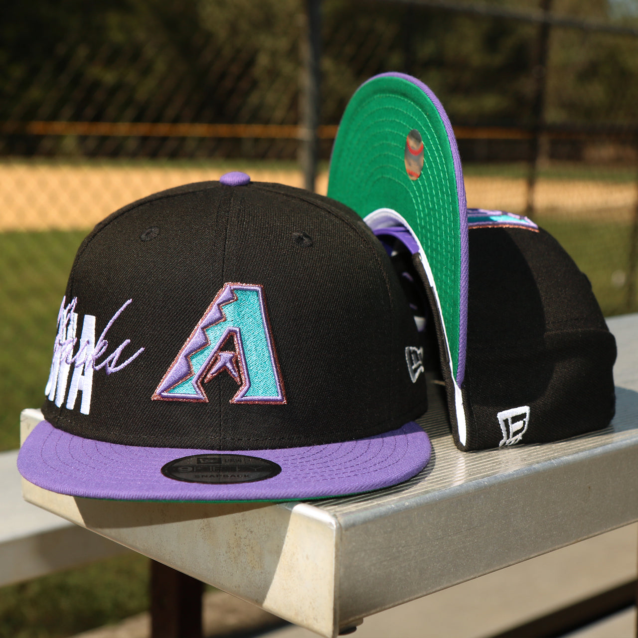 The front of the Cooperstown Arizona Diamondbacks MLB Side Font Green Bottom 9Fifty Snapback Cap | Black Snap Cap