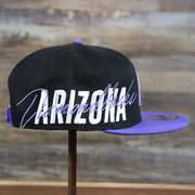 The wearer's right on the Cooperstown Arizona Diamondbacks MLB Side Font Green Bottom 9Fifty Snapback Cap | Black Snap Cap