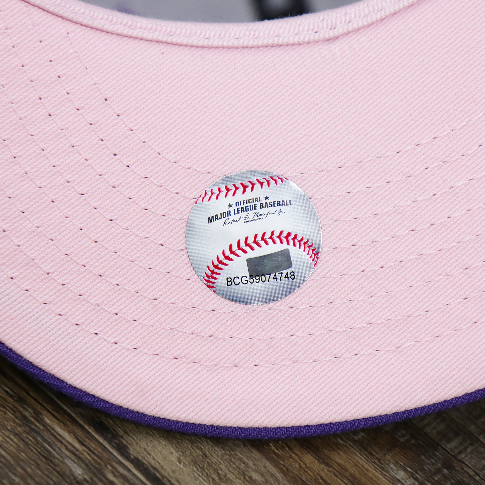 The MLB Sticker on the Cooperstown Arizona Diamondbacks Pop Sweat Pastel World Series Side Patch Fitted Cap With Pink Undervisor | Purple 59Fifty Cap