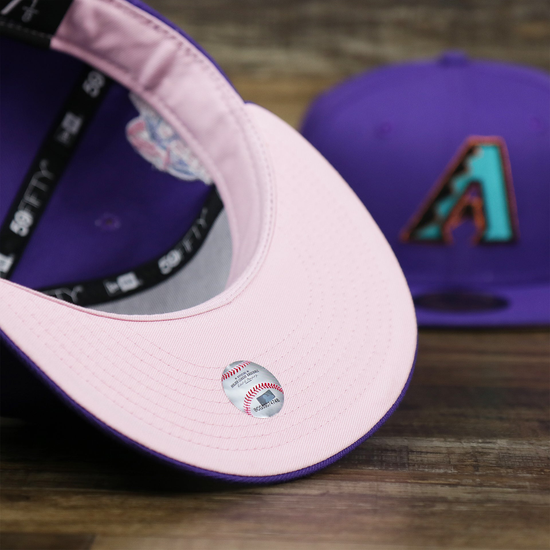The undervisor on the Cooperstown Arizona Diamondbacks Pop Sweat Pastel World Series Side Patch Fitted Cap With Pink Undervisor | Purple 59Fifty Cap