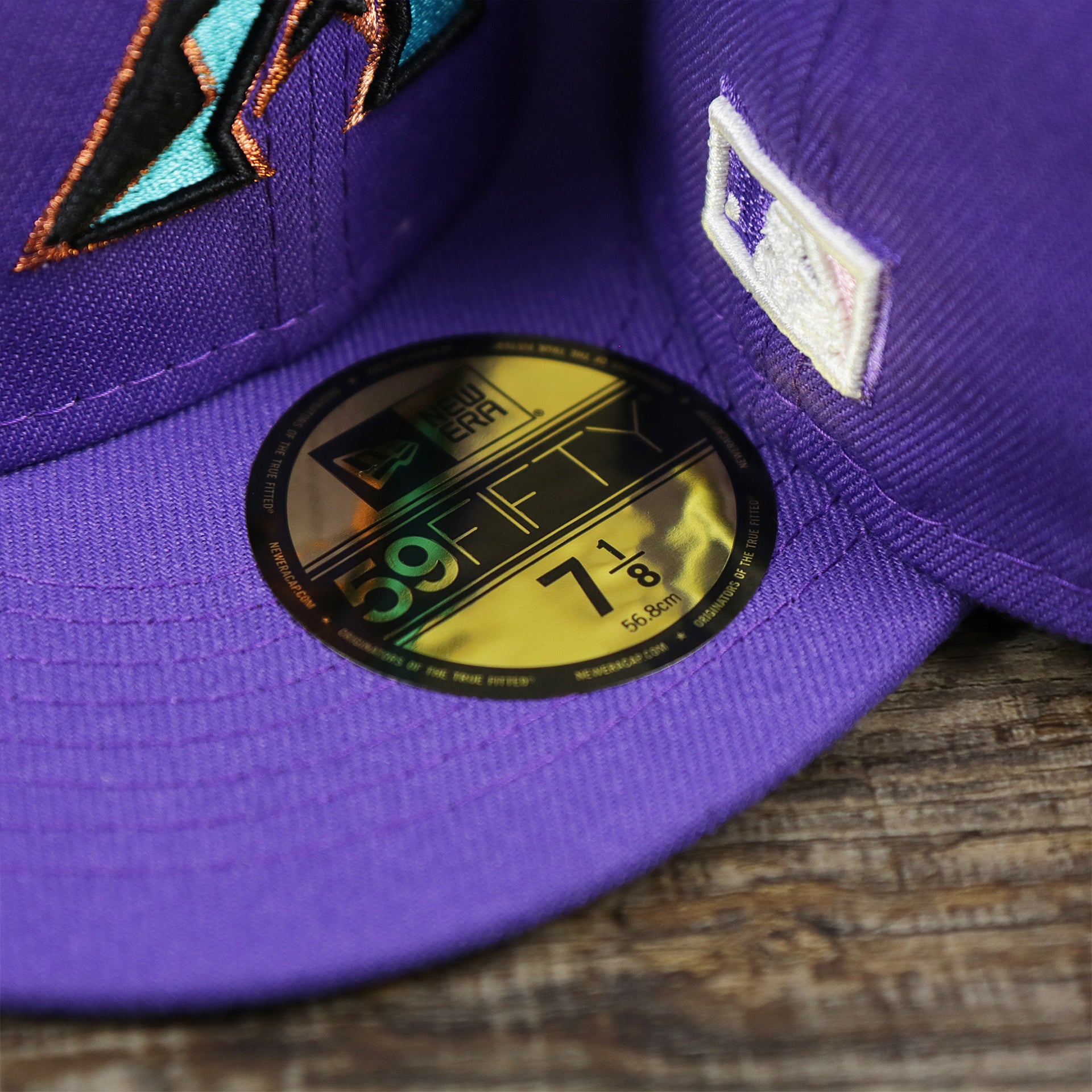 The 59Fifty Sticker on the Cooperstown Arizona Diamondbacks Pop Sweat Pastel World Series Side Patch Fitted Cap With Pink Undervisor | Purple 59Fifty Cap