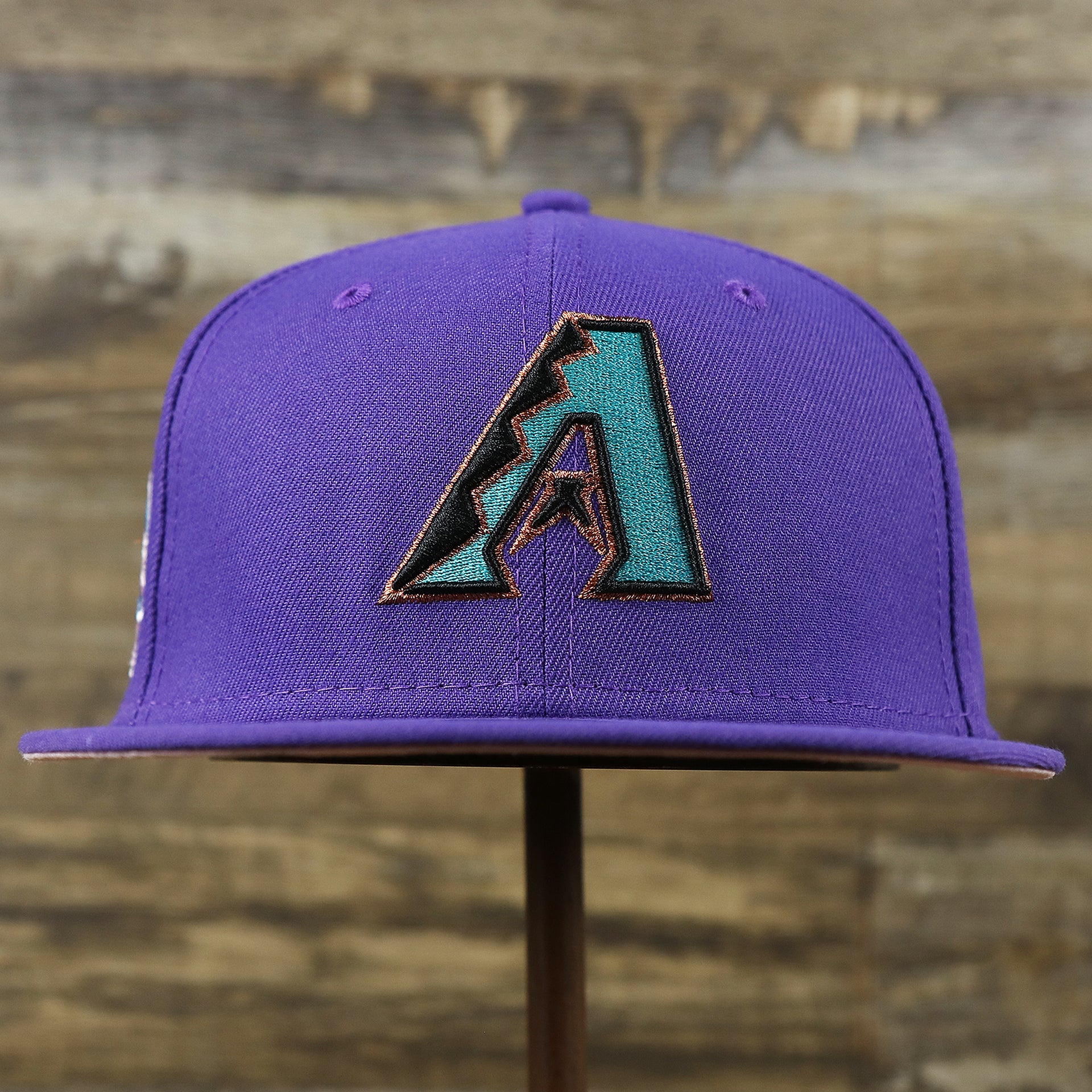 The front of the Cooperstown Arizona Diamondbacks Pop Sweat Pastel World Series Side Patch Fitted Cap With Pink Undervisor | Purple 59Fifty Cap