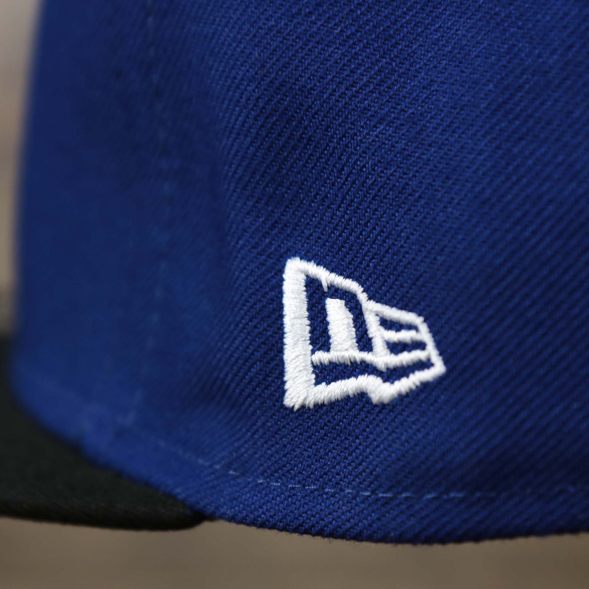 The New Era logo on the Los Angeles Dodgers City Connect Side Patch 9Fifty Snapback Cap | New Era Royal/Black