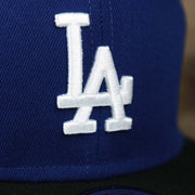 The Dodgers logo on the Los Angeles Dodgers City Connect Side Patch 9Fifty Snapback Cap | New Era Royal/Black