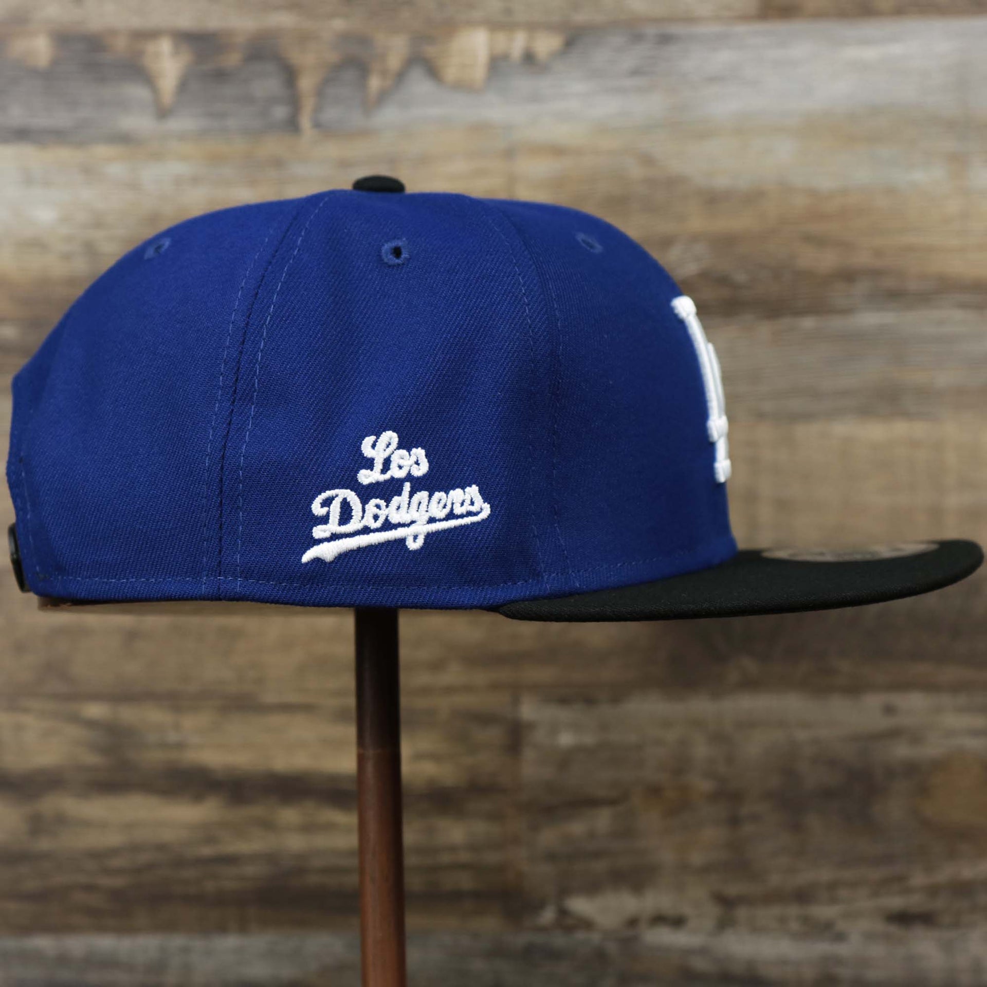 The wearer's right on the Los Angeles Dodgers City Connect Side Patch 9Fifty Snapback Cap | New Era Royal/Black