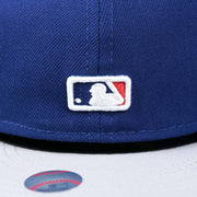 The MLB batterman Logo embroidered on the Los Angeles Dodgers Side Patch Fitted Gray Bottom 59Fifty Cap | Royal Blue 59Fifty