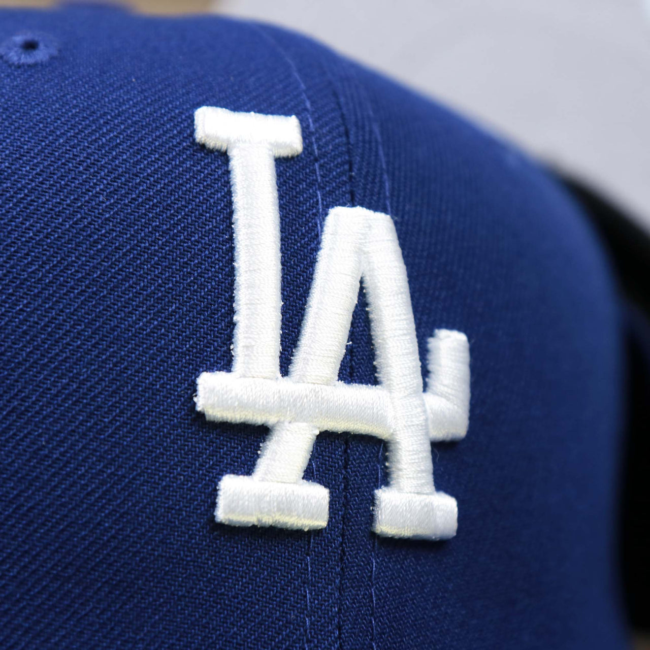 The Dodgers Logo on the Los Angeles Dodgers Side Patch Fitted Gray Bottom 59Fifty Cap | Royal Blue 59Fifty