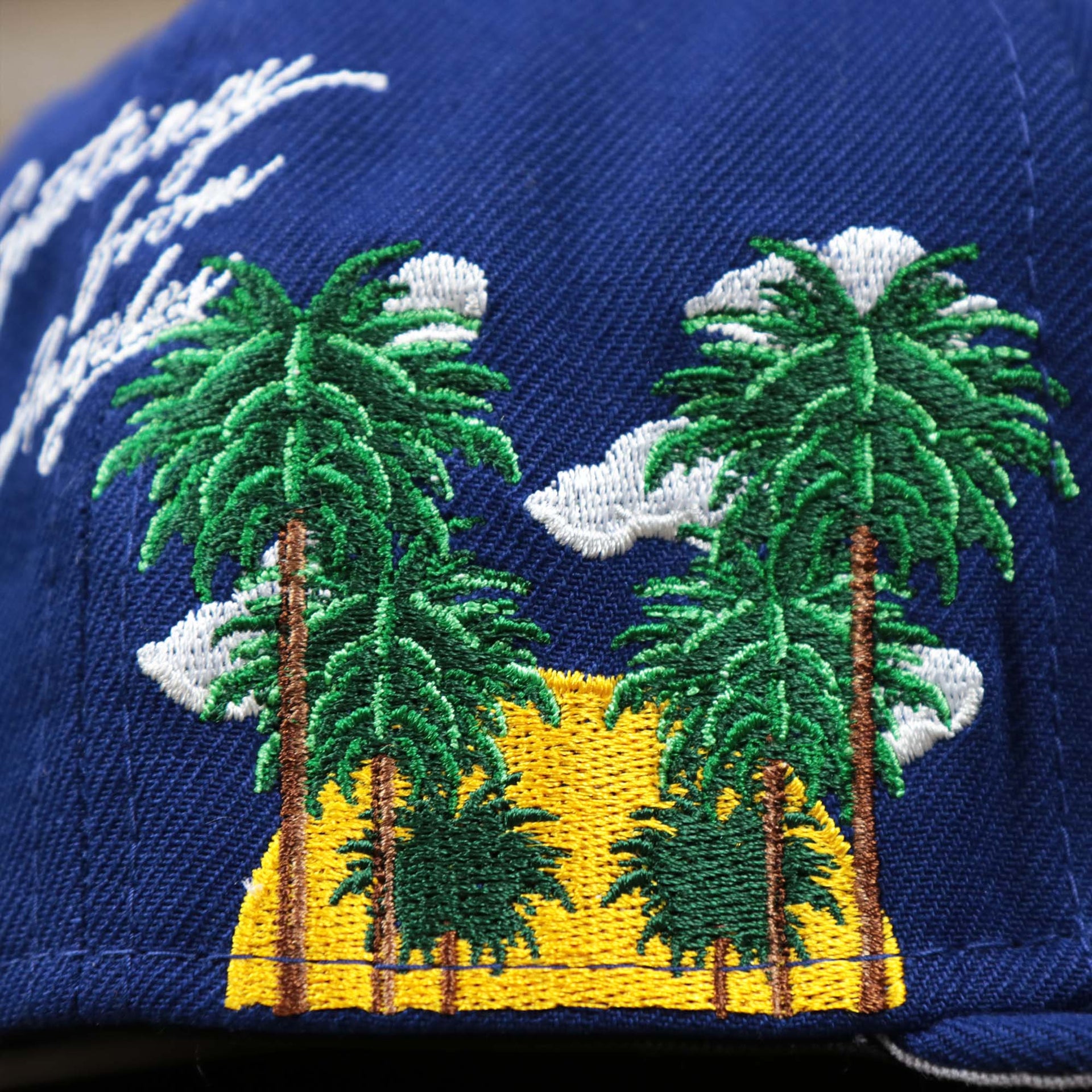 The Trees and setting sun side patch on the Los Angeles Dodgers Side Patch Fitted Gray Bottom 59Fifty Cap | Royal Blue 59Fifty
