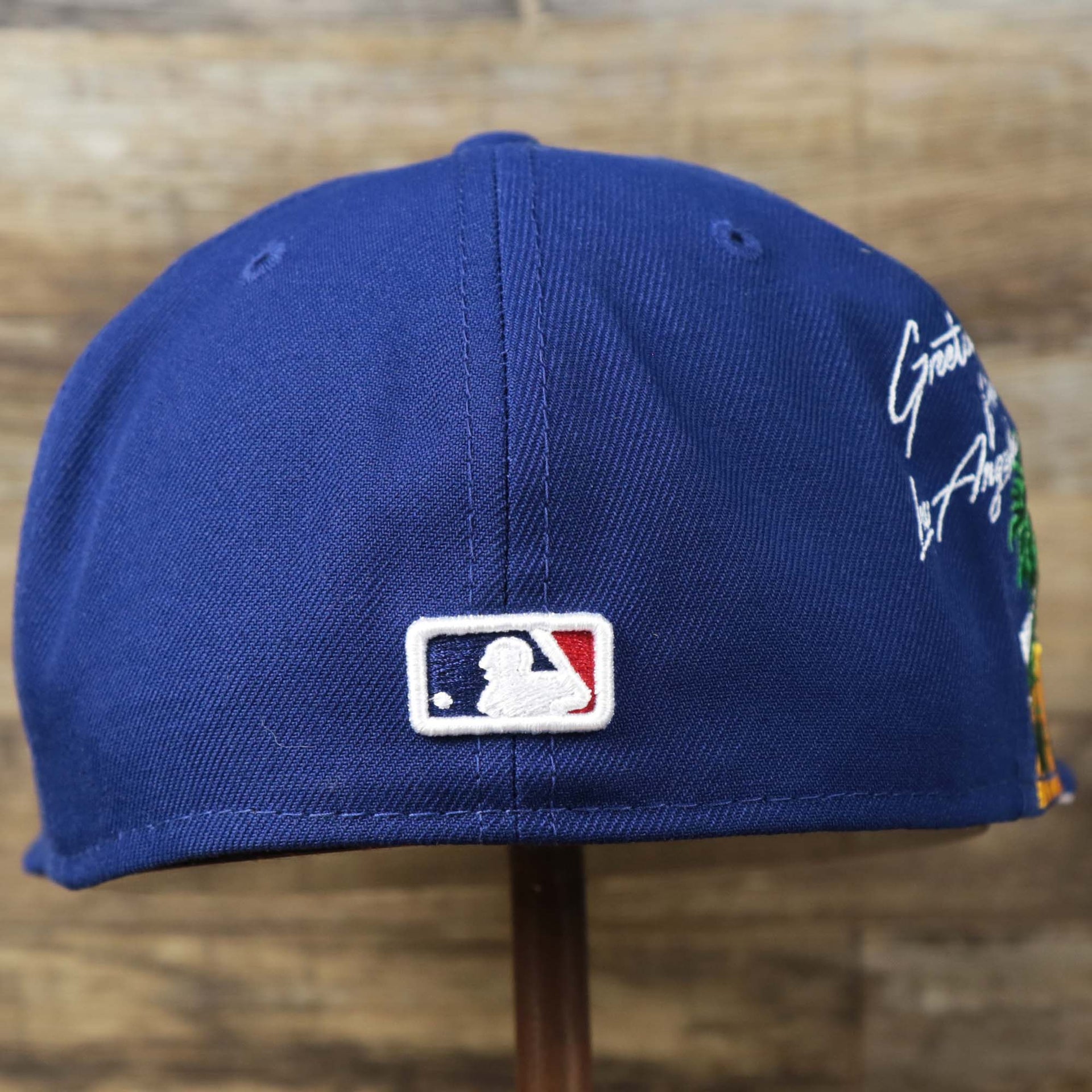 The backside of the Los Angeles Dodgers Side Patch Fitted Gray Bottom 59Fifty Cap | Royal Blue 59Fifty