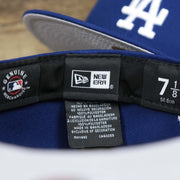 The New Era Tag and MLB Tag on the Los Angeles Dodgers Side Patch Fitted Gray Bottom 59Fifty Cap | Royal Blue 59Fifty