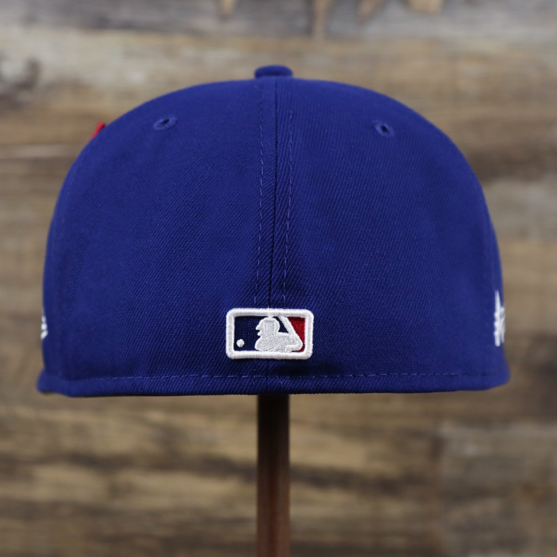 The backside of the Los Angeles Dodgers Alpha Industries Side Patch Army Green Undervisor 59FIfty Fitted Cap With Hangtag | Royal Blue 59FIfty Cap