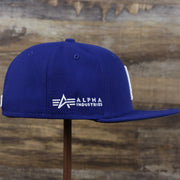 The wearer's right on the Los Angeles Dodgers Alpha Industries Side Patch Army Green Undervisor 59FIfty Fitted Cap With Hangtag | Royal Blue 59FIfty Cap