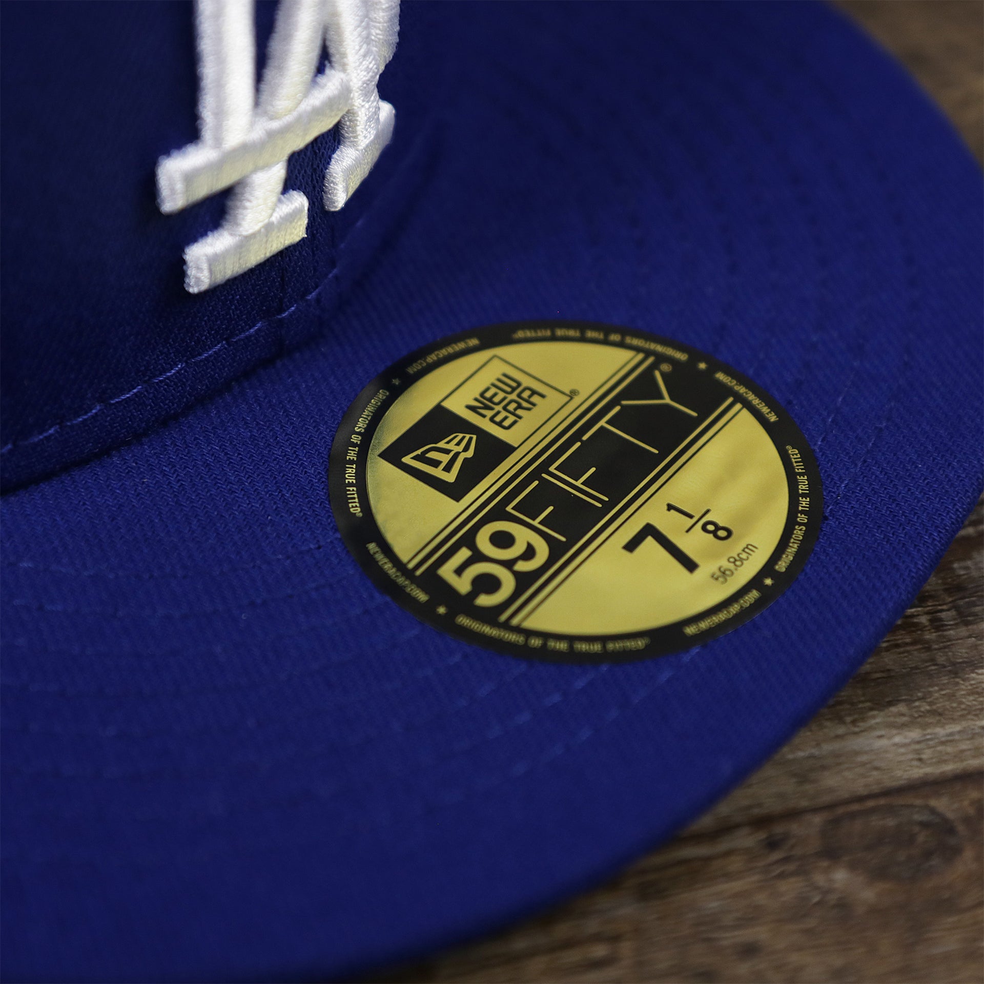 The 59Fifty Sticker on the Los Angeles Dodgers Alpha Industries Side Patch Army Green Undervisor 59FIfty Fitted Cap With Hangtag | Royal Blue 59FIfty Cap