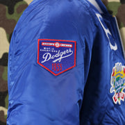 The 1955 Dodgers World Champions Side Patch on the Cooperstown Brooklyn Dodgers MLB Patch Alpha Industries Reversible Bomber Jacket With Camo Liner | Royal Blue Bomber Jacket