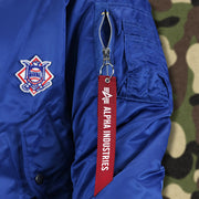 The Alpha Industries Hangtag on the Cooperstown Brooklyn Dodgers MLB Patch Alpha Industries Reversible Bomber Jacket With Camo Liner | Royal Blue Bomber Jacket