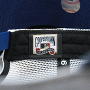 The Cooperstown Collection Tag on the Cooperstown Brooklyn Dodgers 1947s Logo Worn Colorway Mesh Back 9Forty Dad Hat | Royal Blue 9Forty Hat