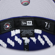 The Tags on the Los Angeles Dodgers Crown Champions Gray Bottom World Championship Wins Embroidered Fitted Cap | Royal Blue 59Fifty Cap