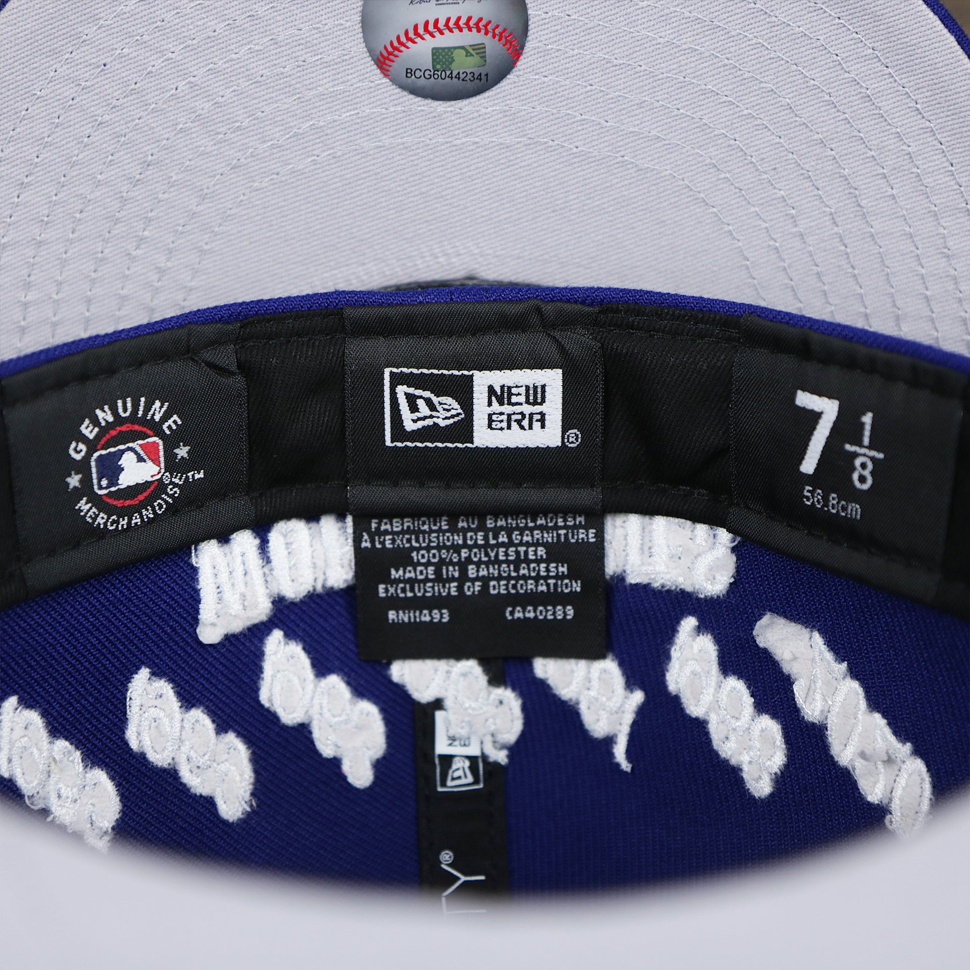 The Tags on the Los Angeles Dodgers Crown Champions Gray Bottom World Championship Wins Embroidered Fitted Cap | Royal Blue 59Fifty Cap