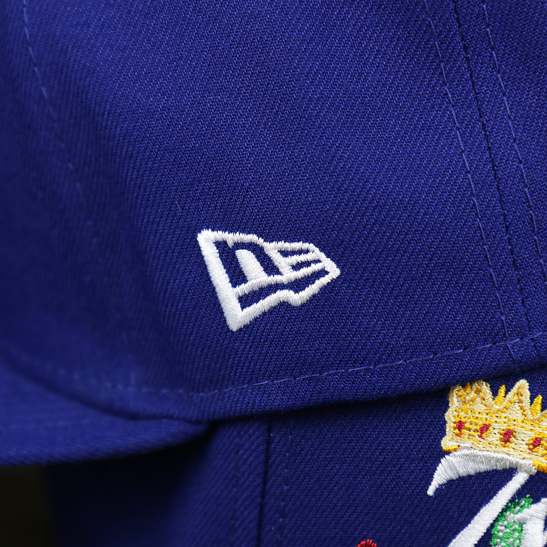 The New Era Logo on the Los Angeles Dodgers Crown Champions Gray Bottom World Championship Wins Embroidered Fitted Cap | Royal Blue 59Fifty Cap