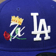 The Dodgers Crown Champions Logo on the Los Angeles Dodgers Crown Champions Gray Bottom World Championship Wins Embroidered Fitted Cap | Royal Blue 59Fifty Cap