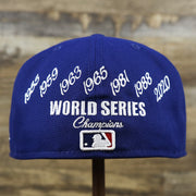 The backside of the Los Angeles Dodgers Crown Champions Gray Bottom World Championship Wins Embroidered Fitted Cap | Royal Blue 59Fifty Cap