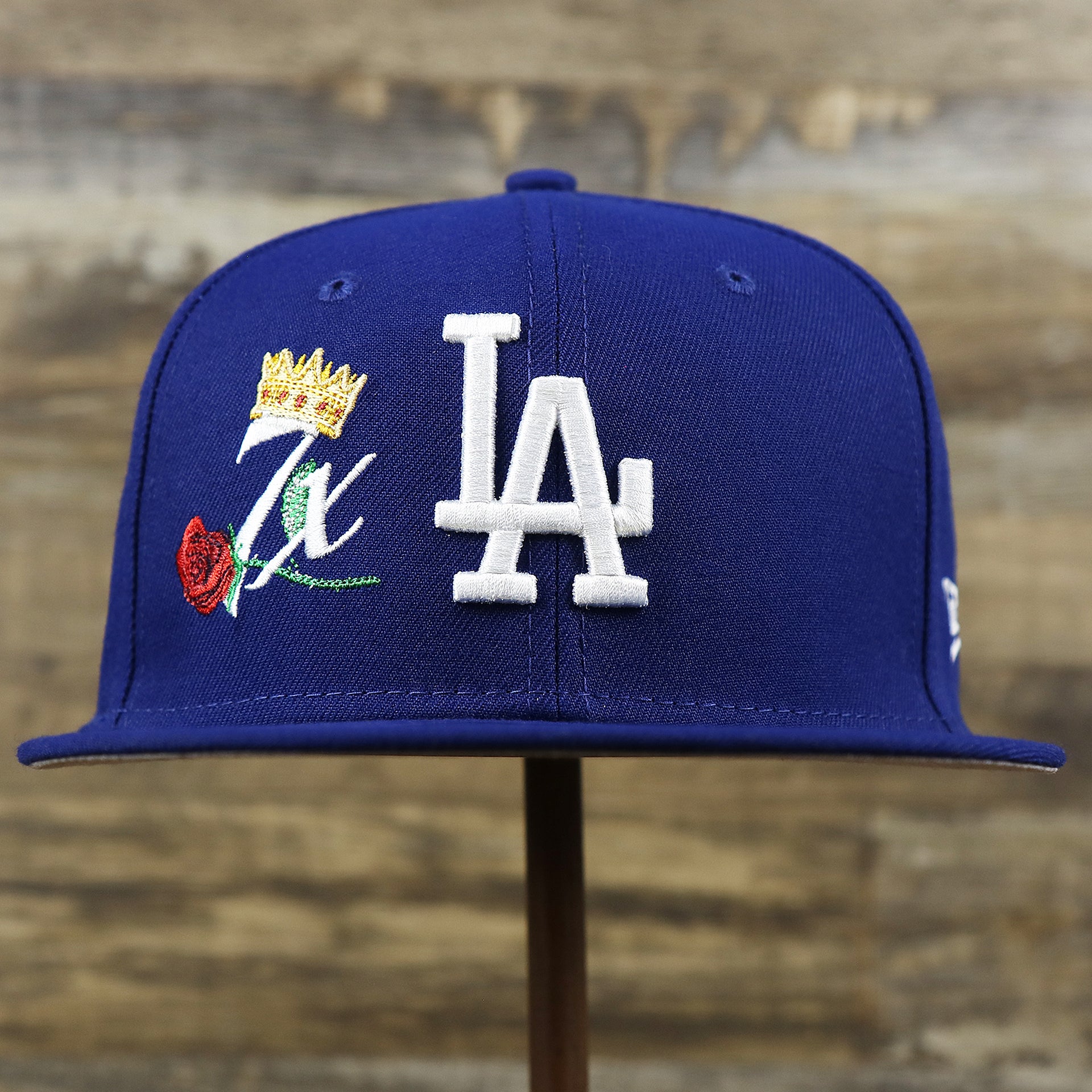 The front of the Los Angeles Dodgers Crown Champions Gray Bottom World Championship Wins Embroidered Fitted Cap | Royal Blue 59Fifty Cap