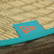 The New Era tag on the Miami Dolphins On Field 2022 Summer Training Straw Hat | New Era OSFM