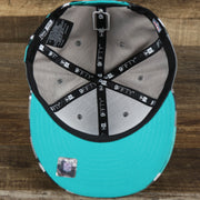 The underside of the Miami Dolphins NFL OnField Summer Training 2022 Camo 9Fifty Snapback | Turquoise Camo 9Fifty
