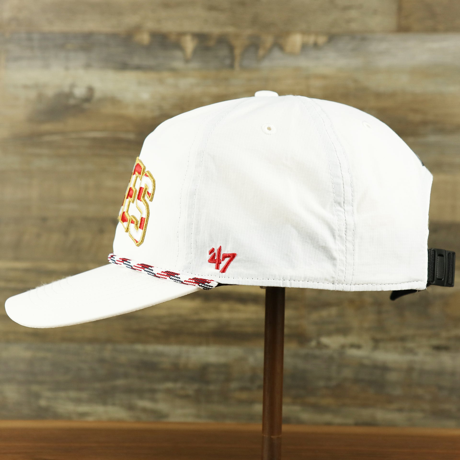 The wearer's left of the Philadelphia Eagles Stars and Stripes Wordmark Gray Bottom Dad Hat | White Dad Hat