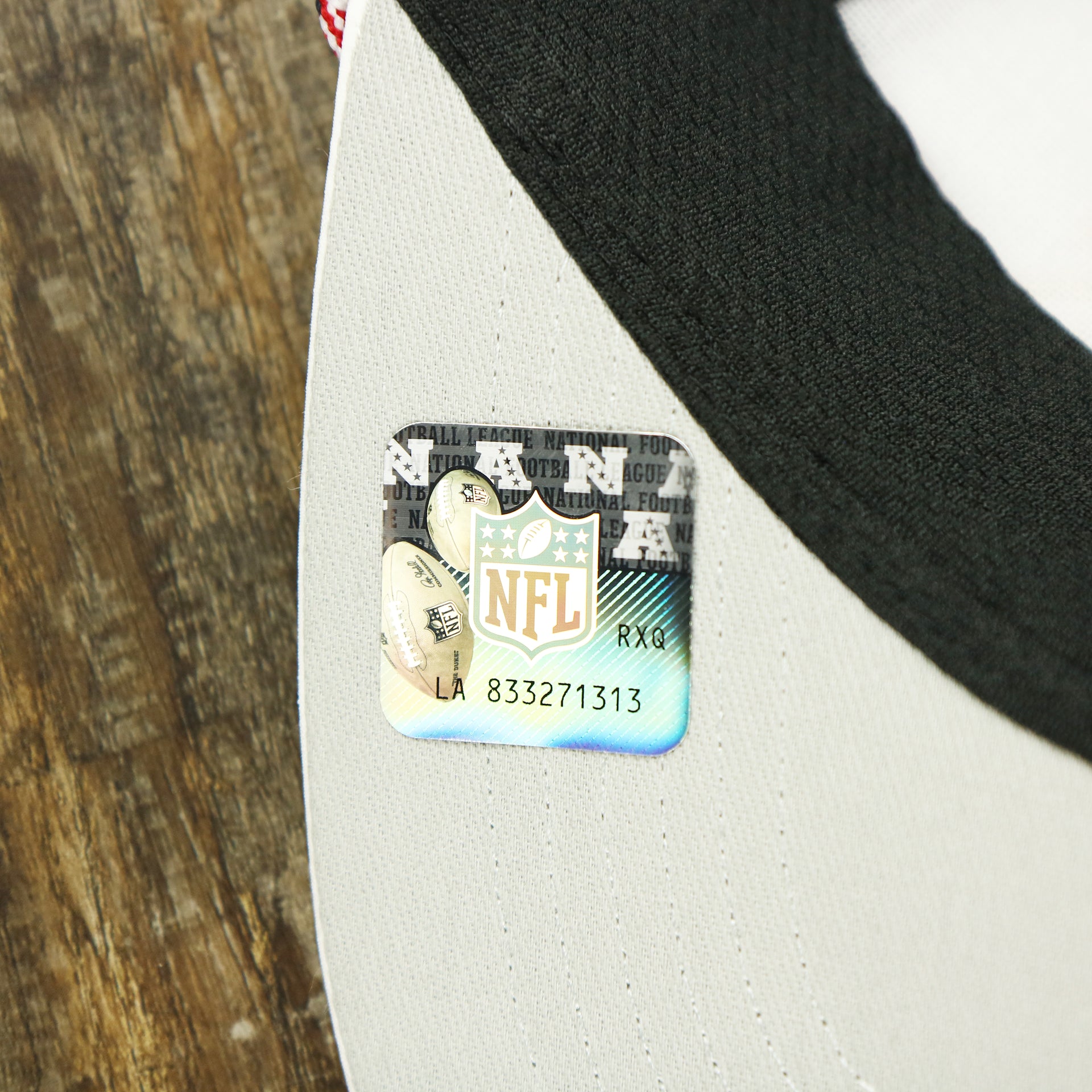The NFL Sticker on the Philadelphia Eagles Stars and Stripes Wordmark Gray Bottom Dad Hat | White Dad Hat